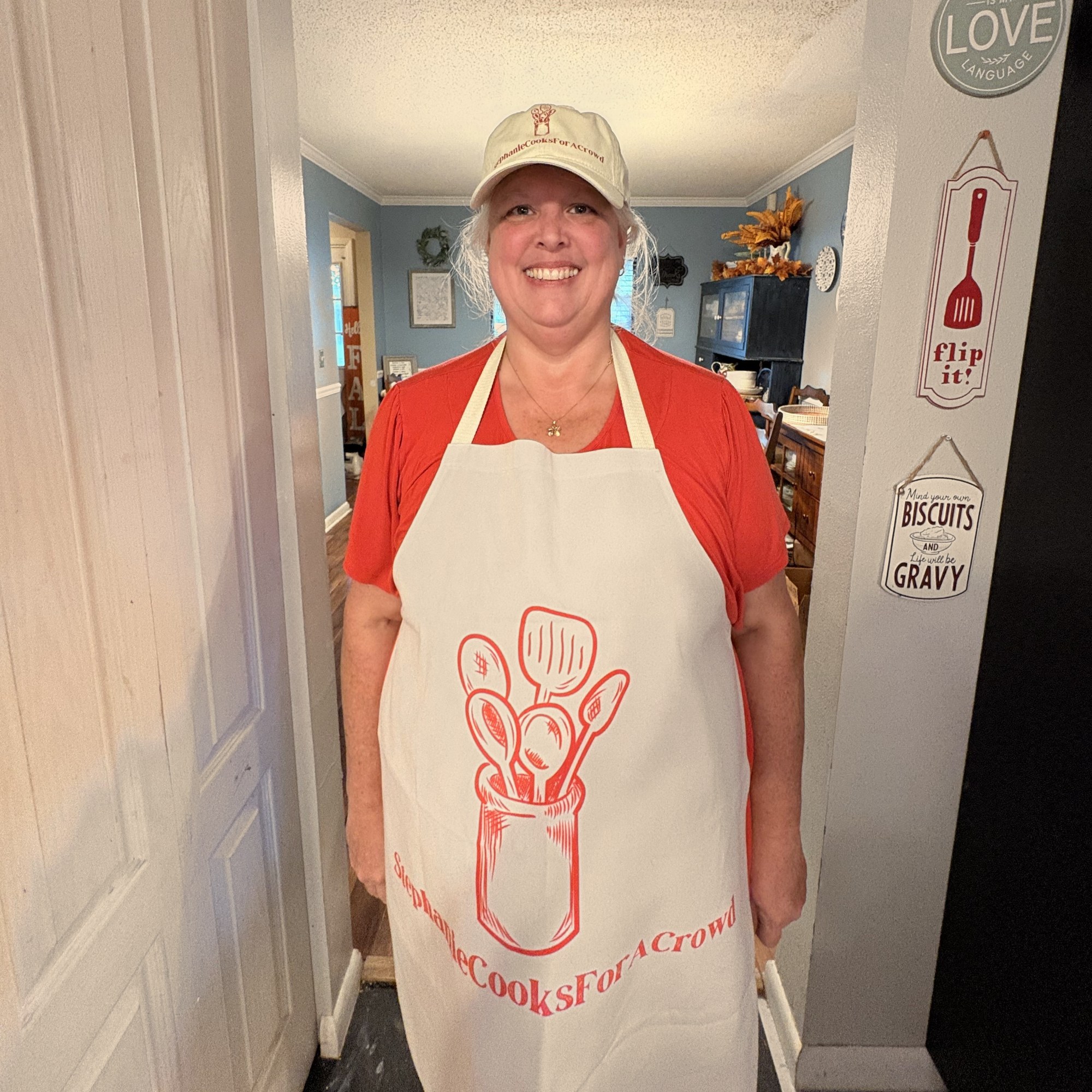 Stephanie wearing the Stephanie Cooks For A Crowd cap and apron together